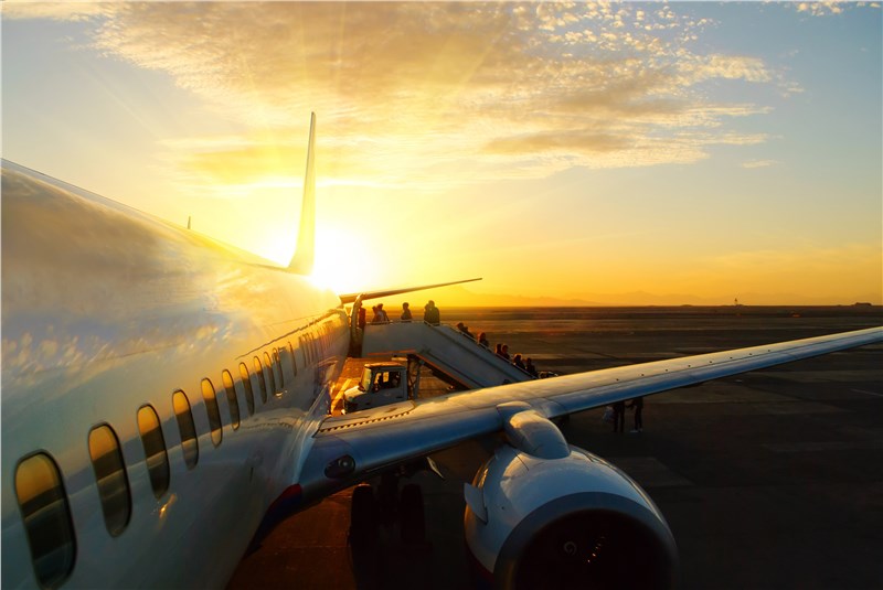 Plane in sunset